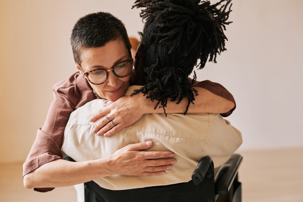 staff supporting patient at therapy session