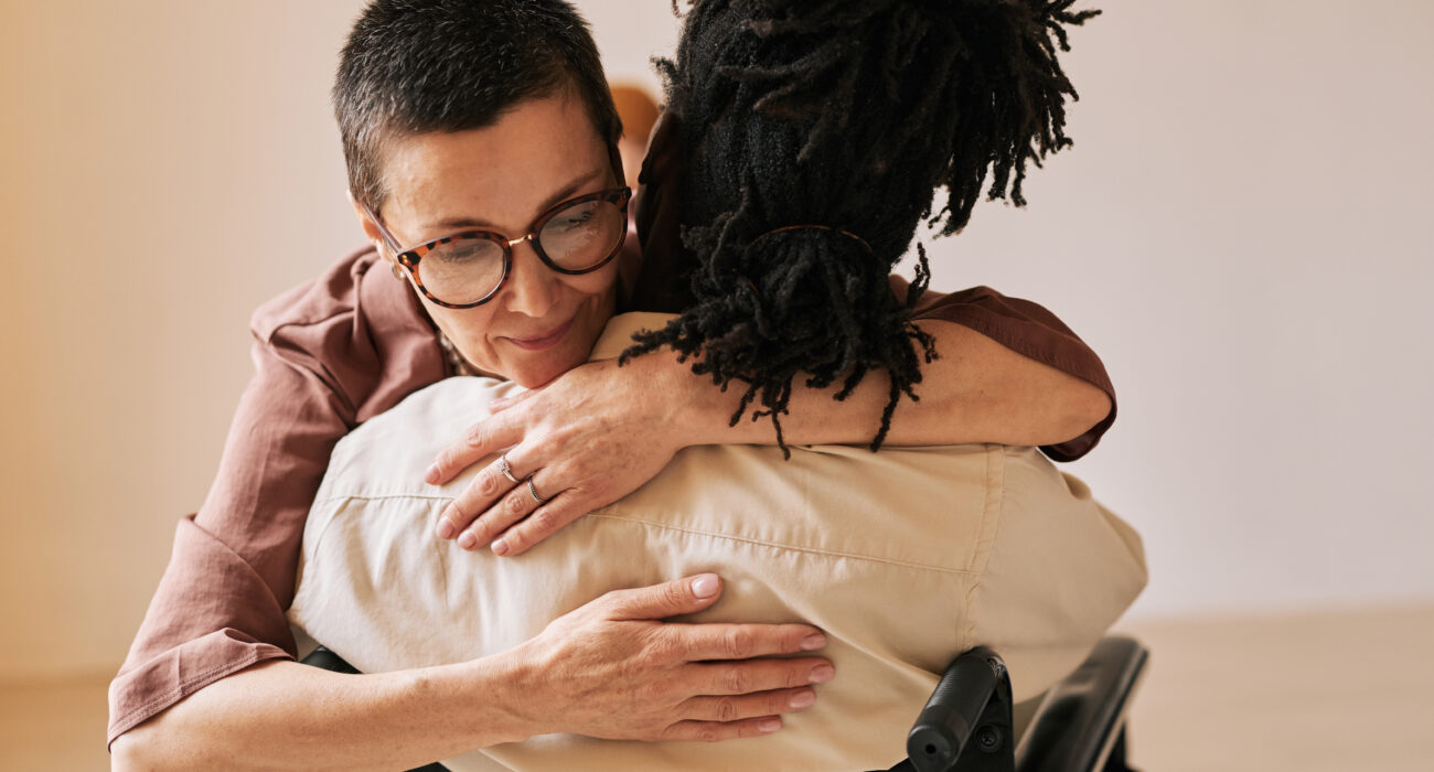 staff supporting patient at therapy session