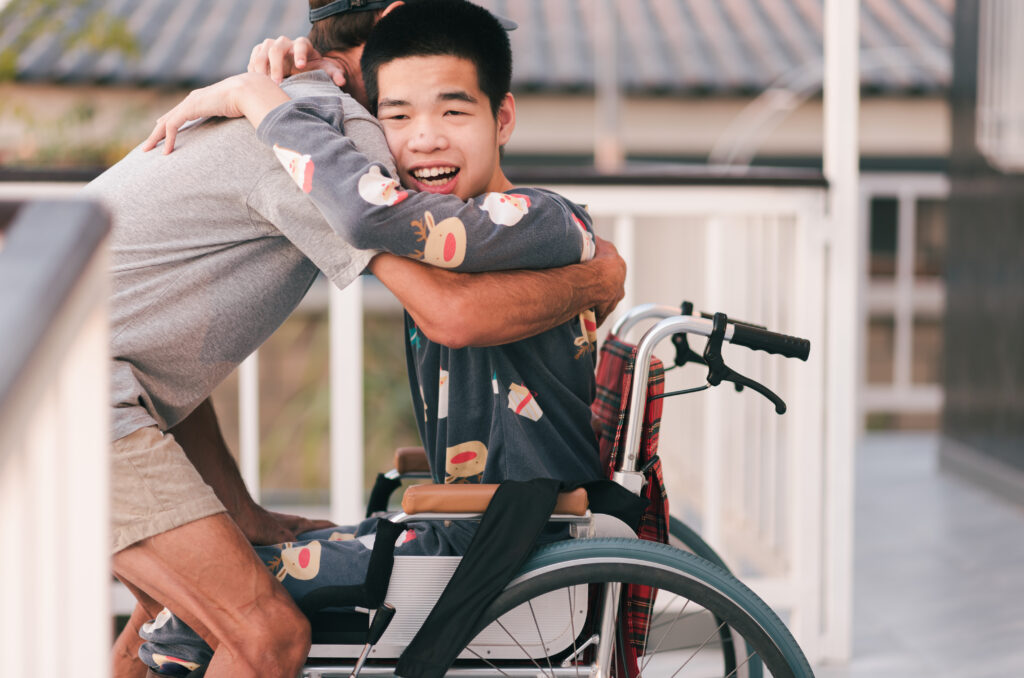 ndis participants hugging one of our care giver