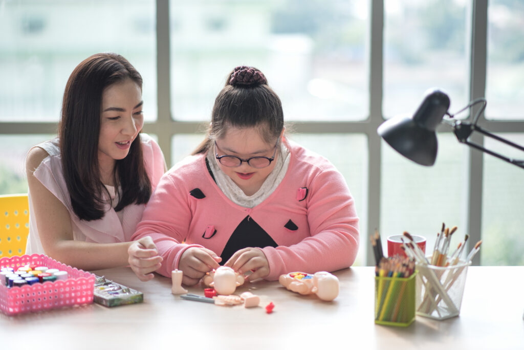 Autistic Participant is learning some life skills from ndis trained participants
